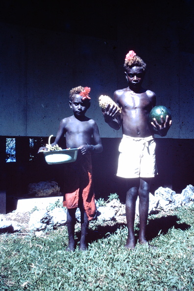1961 April - 2 boys bring fruit from Mara Launa.JPG