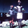 1961 April - 2 boys bring fruit from Mara Launa